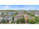 An aerial view of a residential community, displaying varied home styles and neighborhood layout at 14126 Walcott Ave, Orlando, FL 32827