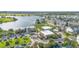 Aerial view of the community featuring a lake and commercial area at 14126 Walcott Ave, Orlando, FL 32827