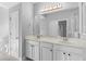 Spacious bathroom featuring double sinks, a large mirror, and modern lighting at 14126 Walcott Ave, Orlando, FL 32827
