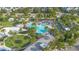 Aerial view of the community pool and splash pad with palm trees and green space at 14126 Walcott Ave, Orlando, FL 32827