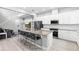 Gourmet kitchen featuring an island with bar seating and stainless steel appliances at 14126 Walcott Ave, Orlando, FL 32827