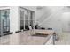 Open concept kitchen featuring an island with sink and stainless steel faucet with a staircase in the background at 14126 Walcott Ave, Orlando, FL 32827