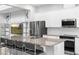 Contemporary kitchen with granite countertops and stainless steel appliances at 14126 Walcott Ave, Orlando, FL 32827