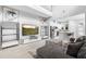 Open-concept living room with high ceilings and an adjacent kitchen at 14126 Walcott Ave, Orlando, FL 32827