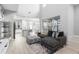 Bright, open-concept living room with soaring ceilings, large windows, and stylish contemporary decor at 14126 Walcott Ave, Orlando, FL 32827