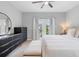Bright main bedroom featuring a ceiling fan and direct access to a private balcony at 14126 Walcott Ave, Orlando, FL 32827