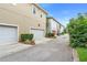 An attractive street view features modern townhomes with manicured lawns and convenient two-car garages at 14126 Walcott Ave, Orlando, FL 32827