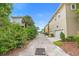 A street view showcases well-maintained townhomes with lush landscaping and convenient garage access at 14126 Walcott Ave, Orlando, FL 32827
