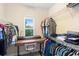A well-organized walk-in closet with shelving and a desk area at 14126 Walcott Ave, Orlando, FL 32827
