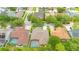Overhead shot of a house with a well maintained roof and a screened-in pool at 14312 Paradise Tree Dr, Orlando, FL 32828