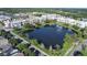 Beautiful aerial view of neighborhood with a pond and fountain at 14312 Paradise Tree Dr, Orlando, FL 32828