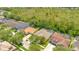 Aerial view of a residential neighborhood with tree lined streets and well manicured lawns at 14312 Paradise Tree Dr, Orlando, FL 32828
