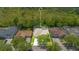 A well-manicured home with screened in pool has a spacious yard, mature landscaping and charming curb appeal at 14312 Paradise Tree Dr, Orlando, FL 32828