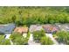 A quaint home with lush landscaping boasts a large yard and a charming, well-maintained exterior at 14312 Paradise Tree Dr, Orlando, FL 32828