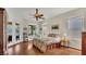 Bright bedroom with hardwood floor, ceiling fan, and natural light from the multiple windows at 14312 Paradise Tree Dr, Orlando, FL 32828
