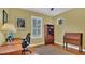 Bedroom featuring an Ansel Adams print, neutral walls, hardwood floors, shutters, and a ceiling fan at 14312 Paradise Tree Dr, Orlando, FL 32828