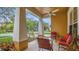 Inviting front porch with comfortable seating, perfect for enjoying the outdoors at 14312 Paradise Tree Dr, Orlando, FL 32828