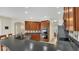 Spacious kitchen with wood cabinets, dark countertops, tile backsplash, stainless steel appliances, and breakfast bar at 14312 Paradise Tree Dr, Orlando, FL 32828