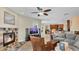 Inviting living room with a cozy fireplace, comfortable seating, and an open layout at 14312 Paradise Tree Dr, Orlando, FL 32828