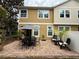 Paver patio with umbrella, table, chairs, and lounge furniture, perfect for outdoor gatherings and relaxation at 14344 Desert Haven St, Windermere, FL 34786