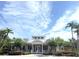 Inviting clubhouse exterior featuring a charming entrance and well-maintained landscaping in a sunny setting at 14344 Desert Haven St, Windermere, FL 34786