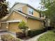 This charming townhome boasts a two-car garage and a manicured lawn at 14344 Desert Haven St, Windermere, FL 34786