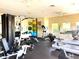 Well-equipped gym with treadmills, stationary bikes, weight machines, and free weights for a complete workout experience at 14344 Desert Haven St, Windermere, FL 34786