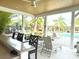 Poolside bar and lounge area with comfortable seating, providing a perfect spot for relaxation and socializing at 14344 Desert Haven St, Windermere, FL 34786