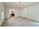 Well-lit bedroom with modern light fixture and bathroom access at 148 Hampton Loop, Davenport, FL 33837