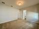 Spacious bedroom with neutral carpet, ample natural light, and convenient access to bathroom at 148 Hampton Loop, Davenport, FL 33837