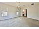 Large, bright bedroom with a modern light fixture and ensuite bathroom access at 148 Hampton Loop, Davenport, FL 33837