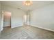 Neutral bedroom features carpet floors, access to closet and open doorway at 148 Hampton Loop, Davenport, FL 33837