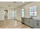 Dining room with bar area, tile flooring, and many windows, and view to bathroom at 148 Hampton Loop, Davenport, FL 33837