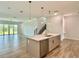 Kitchen island featuring pendant lighting, stainless steel appliances, and an open floor plan at 148 Hampton Loop, Davenport, FL 33837