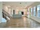 Bright and open kitchen featuring stainless steel appliances and wood flooring at 148 Hampton Loop, Davenport, FL 33837