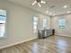 Spacious living room boasts recessed lighting, wood-look floors, and a stylish wet bar at 148 Hampton Loop, Davenport, FL 33837