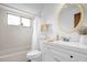 Bright bathroom with a tub/shower, vanity, and a round mirror at 1508 Southwind Ct, Casselberry, FL 32707