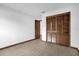 Bedroom showcasing closet with a wooden-look bifold door and new flooring at 1508 Southwind Ct, Casselberry, FL 32707