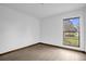 An empty bedroom with modern flooring and a large window at 1508 Southwind Ct, Casselberry, FL 32707