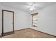 Cozy bedroom with a ceiling fan, natural light, and neutral decor at 1508 Southwind Ct, Casselberry, FL 32707