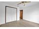 Bedroom features laminate floors and closet with bifold doors at 1508 Southwind Ct, Casselberry, FL 32707