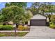 Charming single-story home with a well-maintained lawn, mature trees, and a two-car garage at 1508 Southwind Ct, Casselberry, FL 32707