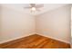 Hardwood flooring with a ceiling fan adds character to this bedroom at 168 Hill St, Casselberry, FL 32707