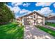 Home exterior featuring a two-car garage and well-kept lawn at 168 Hill St, Casselberry, FL 32707