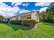 The home features a well-maintained lawn with lush green grass and mature hedges at 168 Hill St, Casselberry, FL 32707