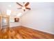 Bright living room featuring hardwood floors, a ceiling fan, and pass through to the kitchen at 168 Hill St, Casselberry, FL 32707