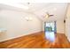 Spacious living room with hardwood floors, skylight, and slider doors at 168 Hill St, Casselberry, FL 32707