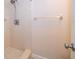 This bathroom has a classic shower with white tiling and a modern shower head for an updated look at 168 Hill St, Casselberry, FL 32707