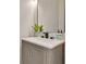 Stylish bathroom sink with modern hardware, neutral color scheme, and bright mirror at 17657 Windy Pine St, Montverde, FL 34756