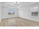 Spacious bedroom with modern lighting and a large window at 17657 Windy Pine St, Montverde, FL 34756